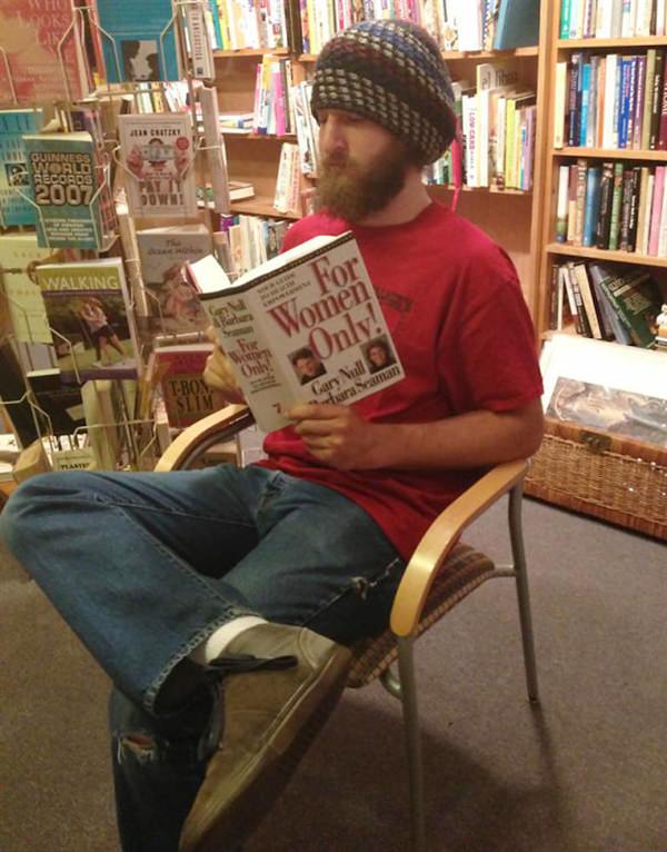 Guy reading a book for women only